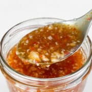 Close up shot of the sweet chili sauce on a spoon.