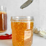 Side profile of Vietnamese dipping sauce nuoc cham in a jar.