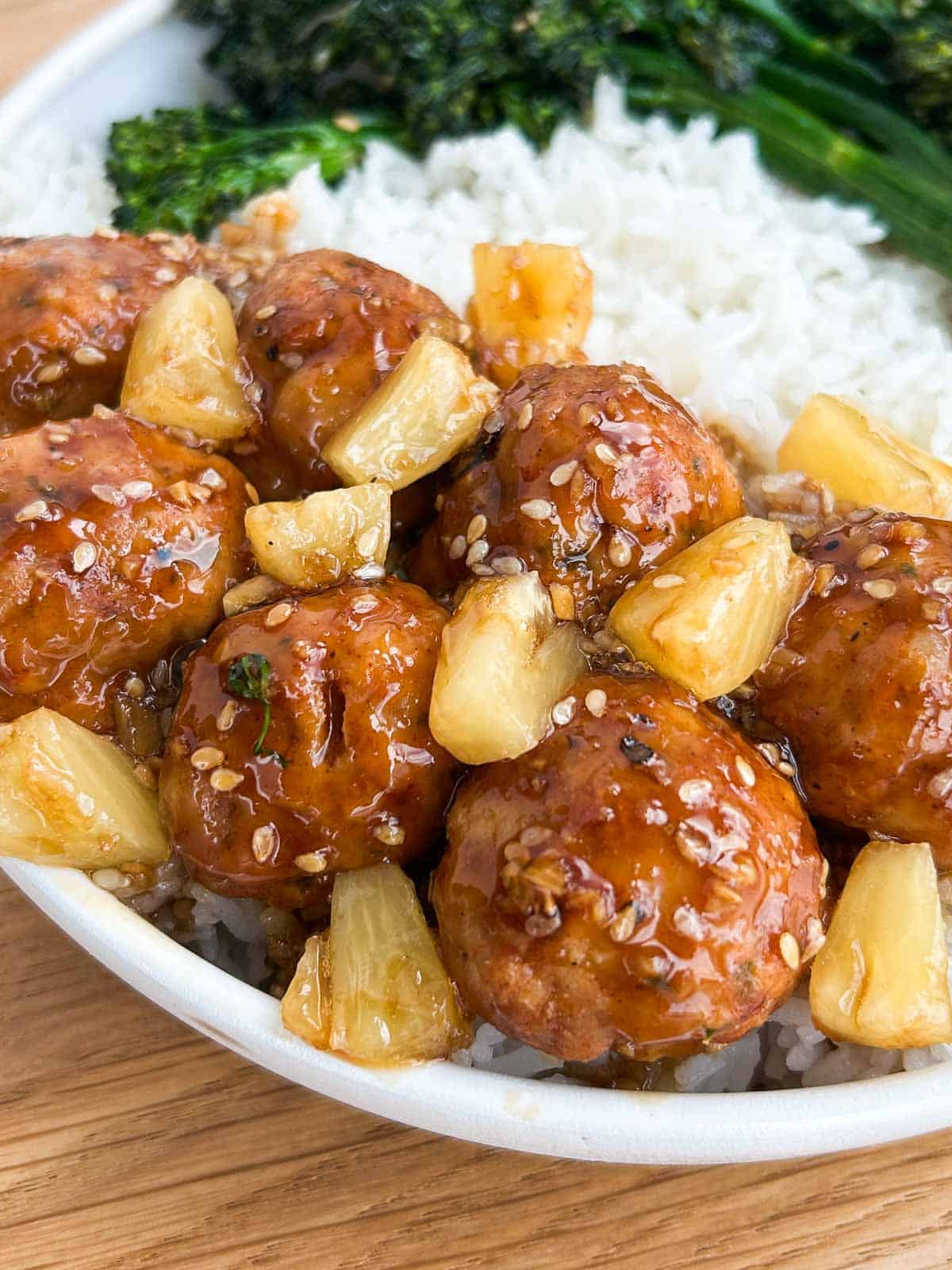 A larger profile of chicken meatballs and pineapples.