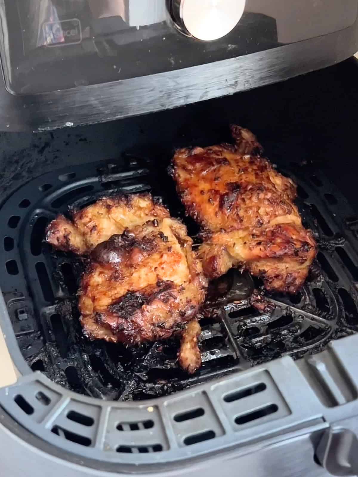 Air fryer lemongrass chicken in the air fryer after cooking.
