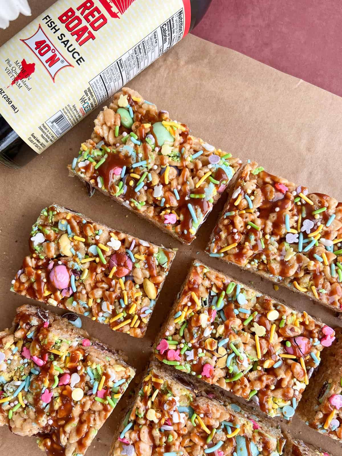 Overhead shot of fish sauce caramel rice crispy treats on parchment paper.