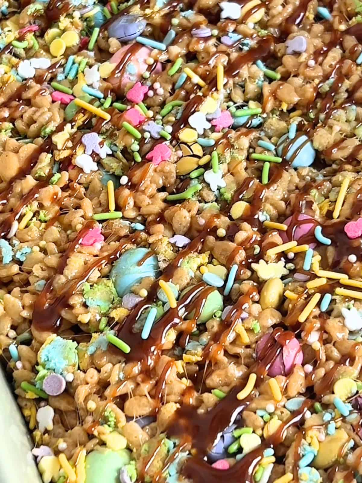 Fish sauce caramel rice krispy treats pressed into a baking dish and garnished with sprinkles.