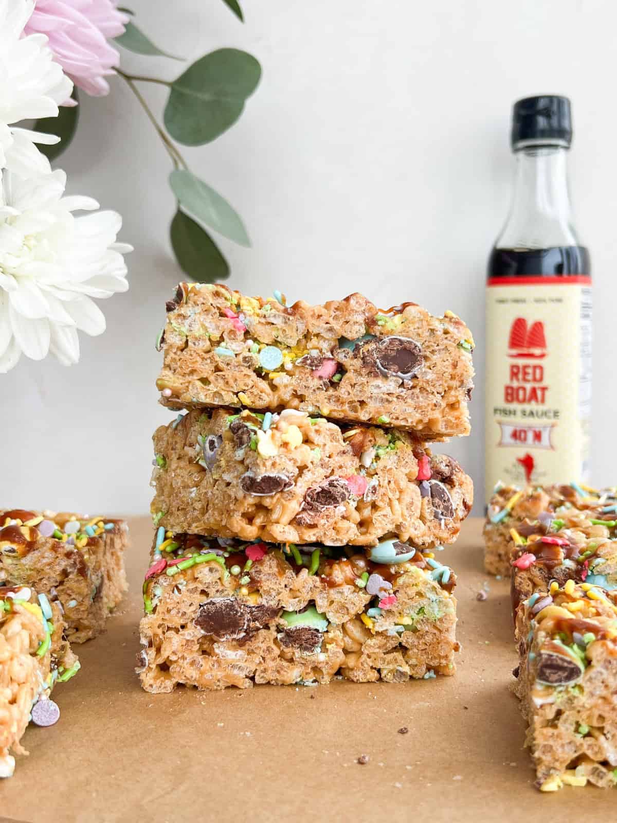 Fish sauce caramel rice krispy treats stacked on top of each other.