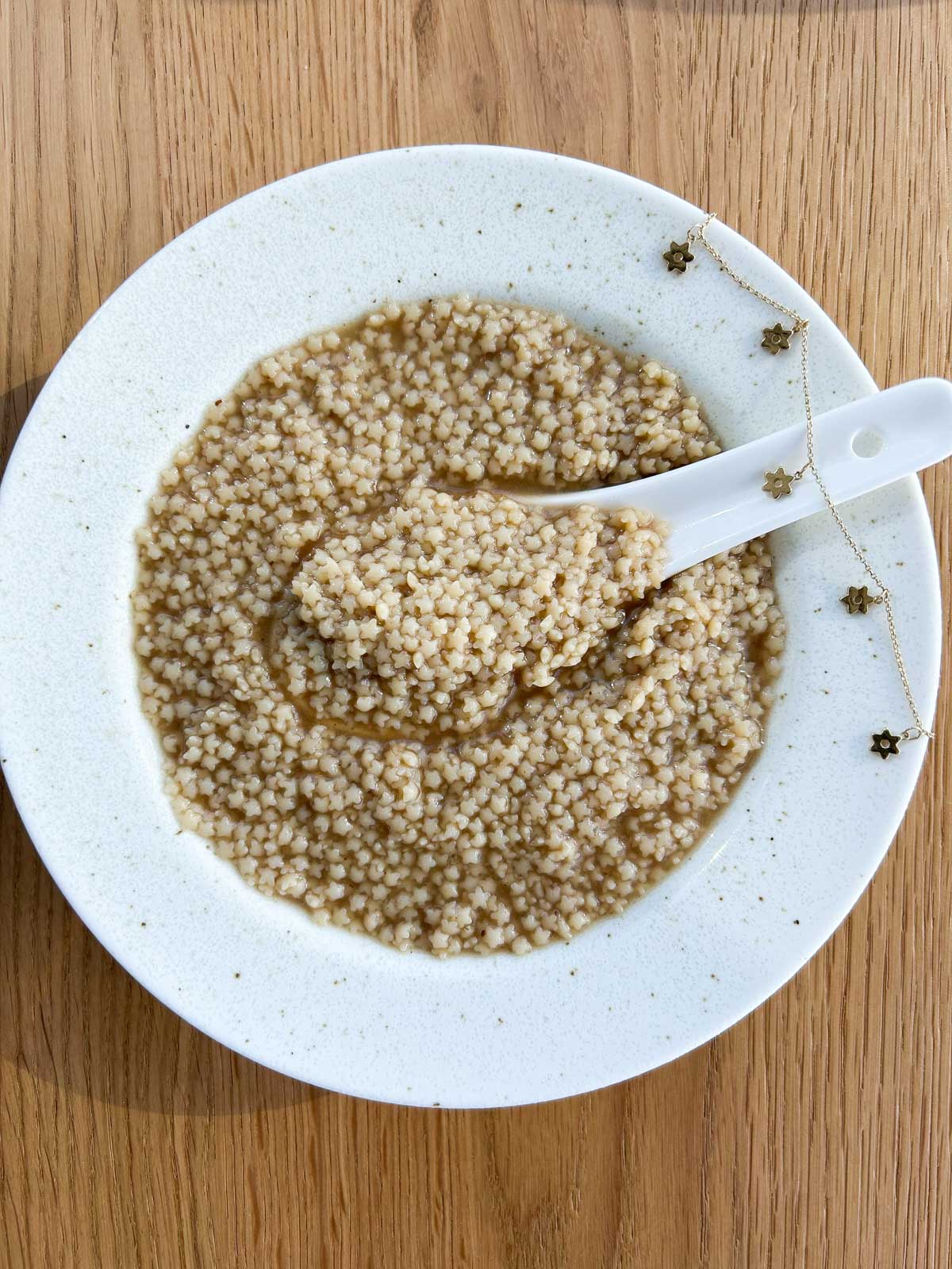 Overview of a bowl of pho pastina in a bowl plate.