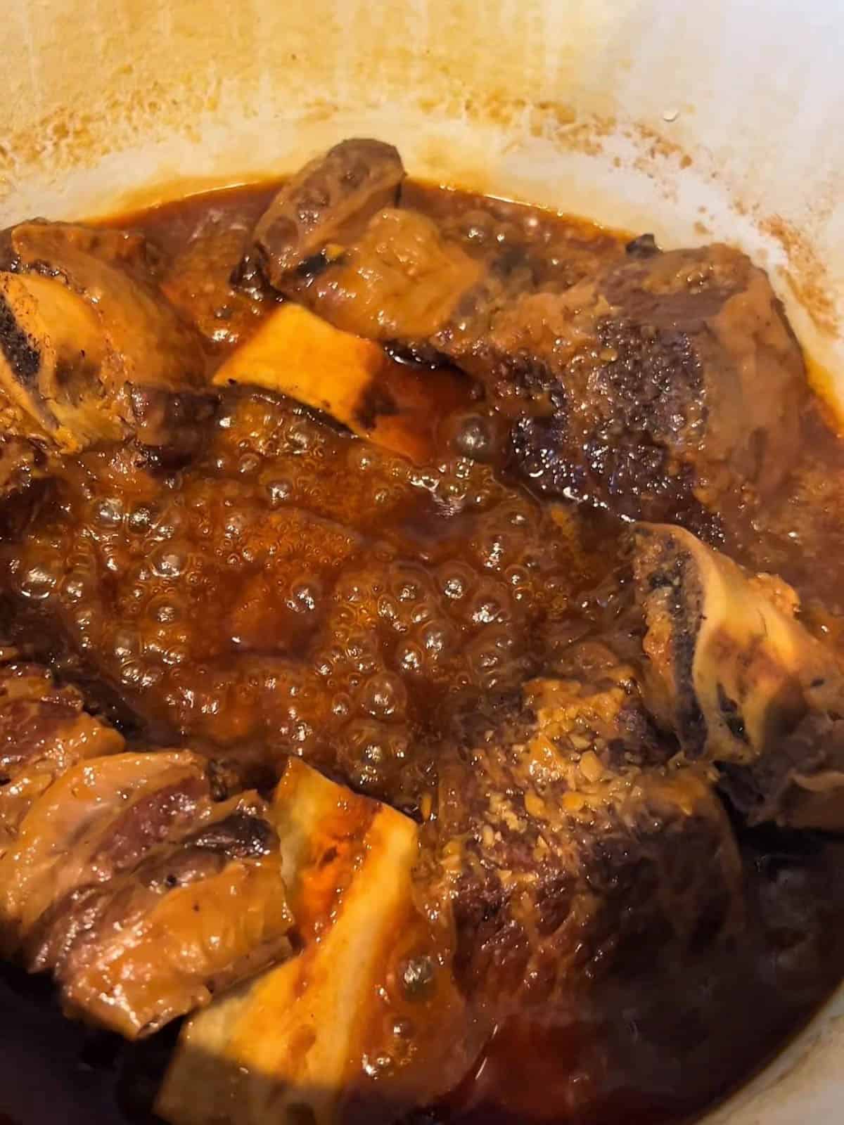 Bone in short ribs simmered in a thickened gochujang glaze and falling off the bone.