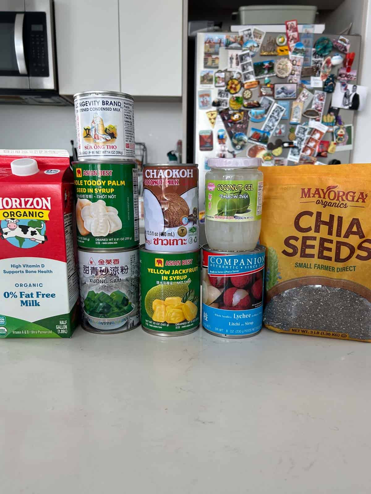 Shot of all the cans of fruit, milk and chia seeds.