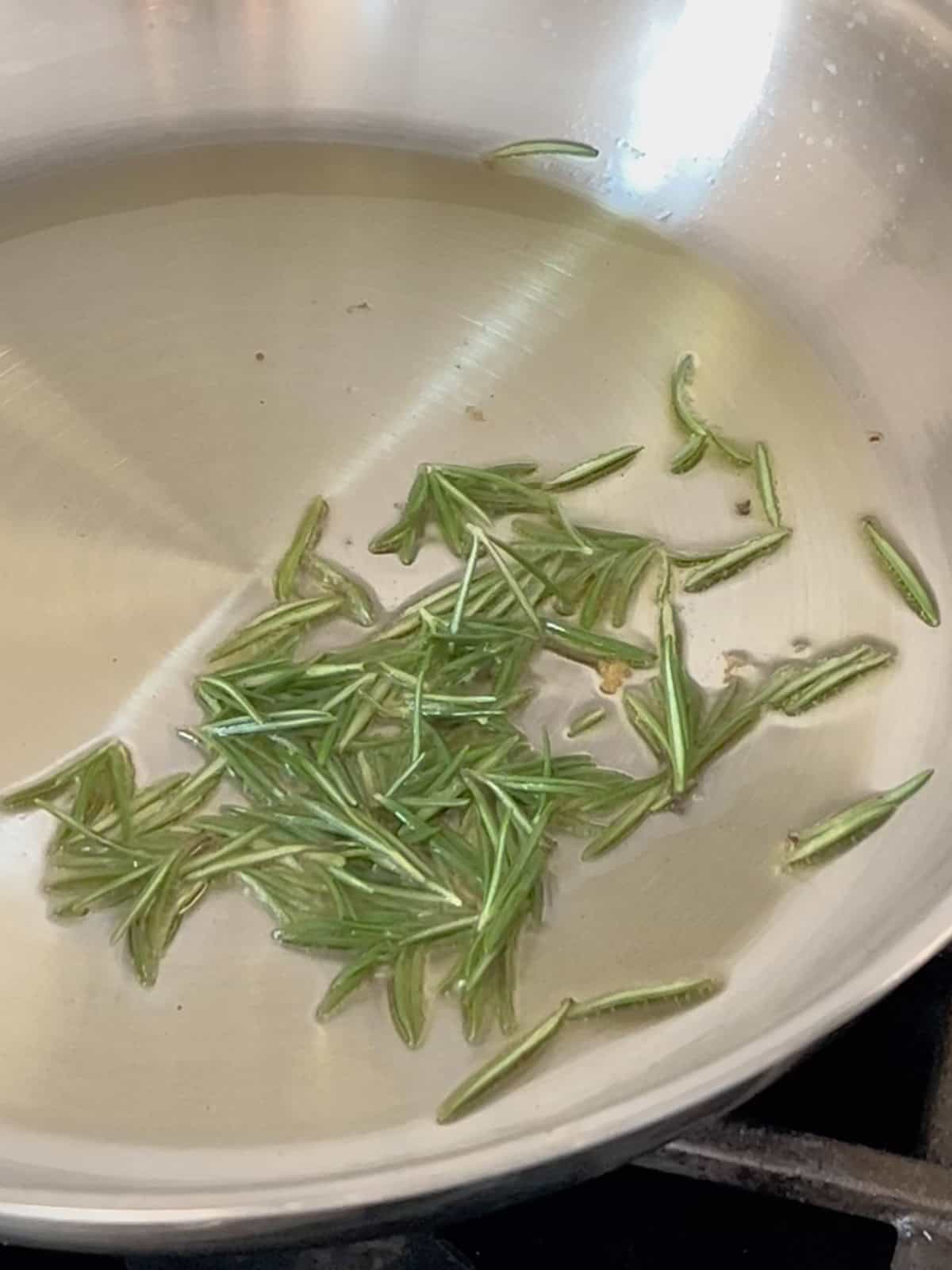 Rosemary needles fried in a pan.