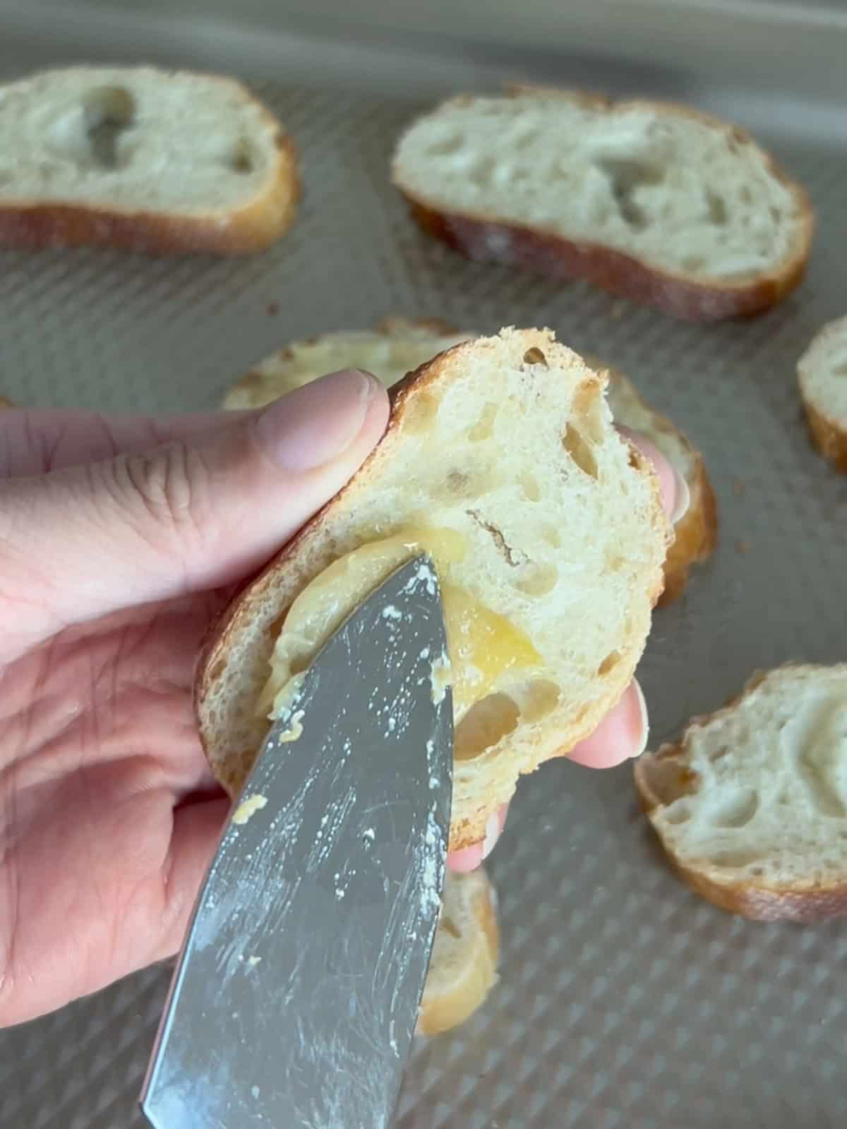 Garlic confit spread on bread.