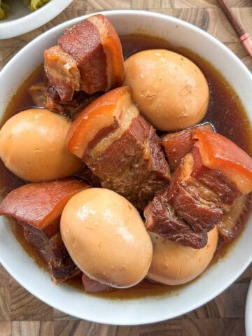 Overhead shot of braised pork belly and hard boiled eggs.