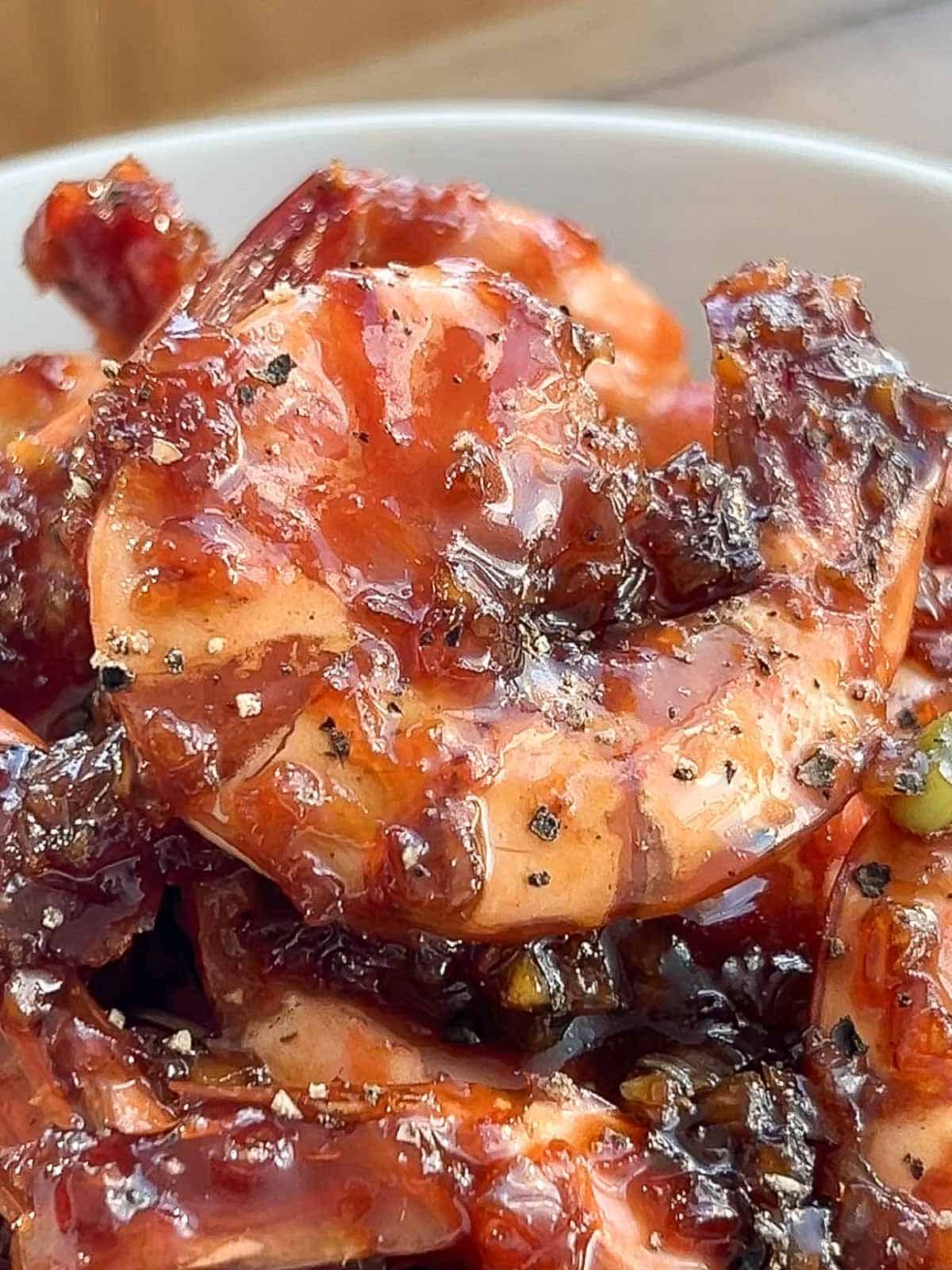 Glaze on top of caramelized shrimp.