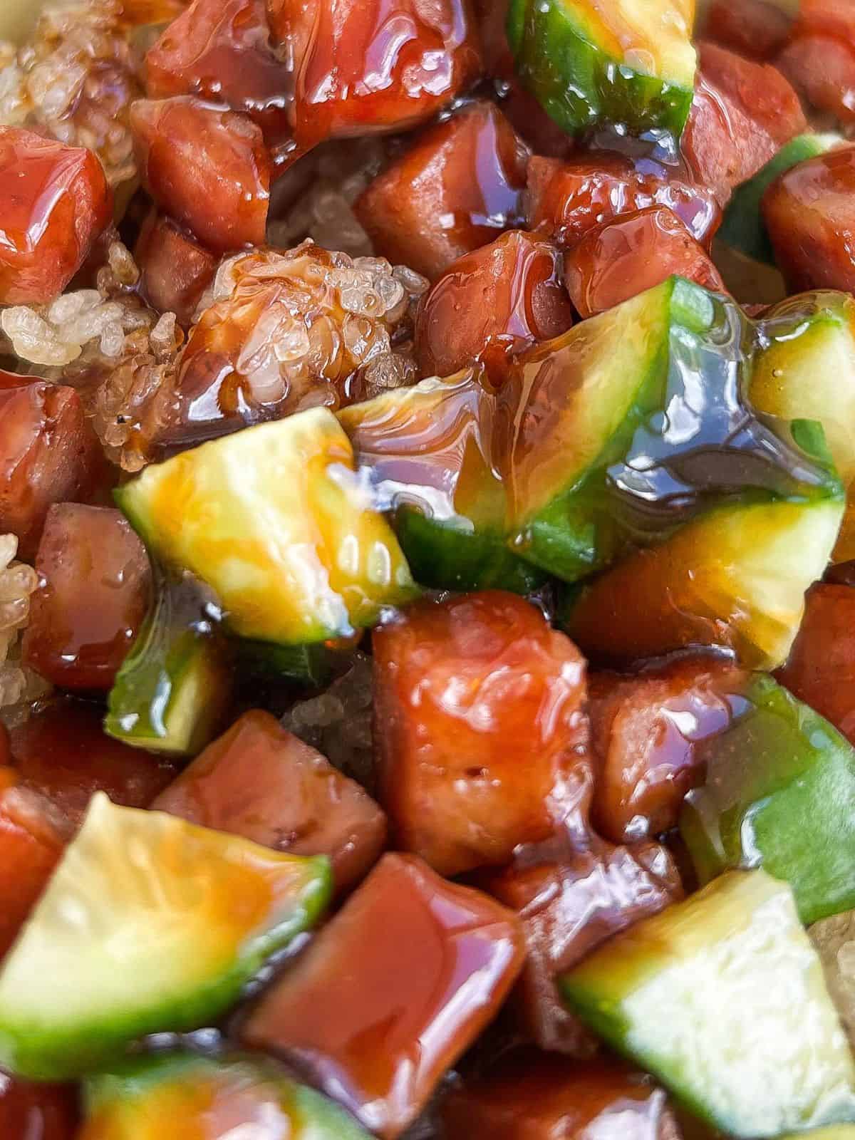 Spam musubi crispy rice salad with diced Spam, chopped cucumber, and crispy rice coated in a glossy sweet and savory glaze.