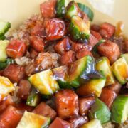 1x1 photo of diced Spam, cucumber, crispy rice tossed in a musubi glaze.