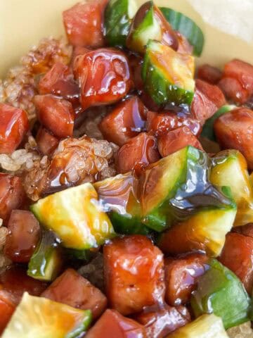 1x1 photo of diced Spam, cucumber, crispy rice tossed in a musubi glaze.
