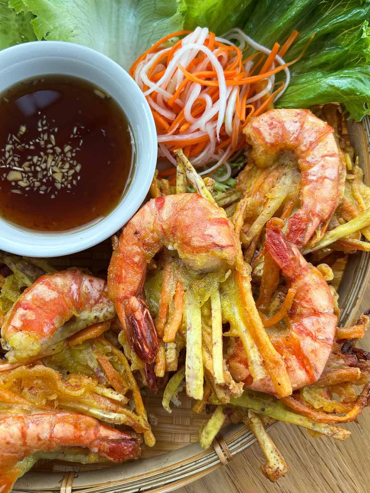 Fried shrimp fritters with fish sauce.