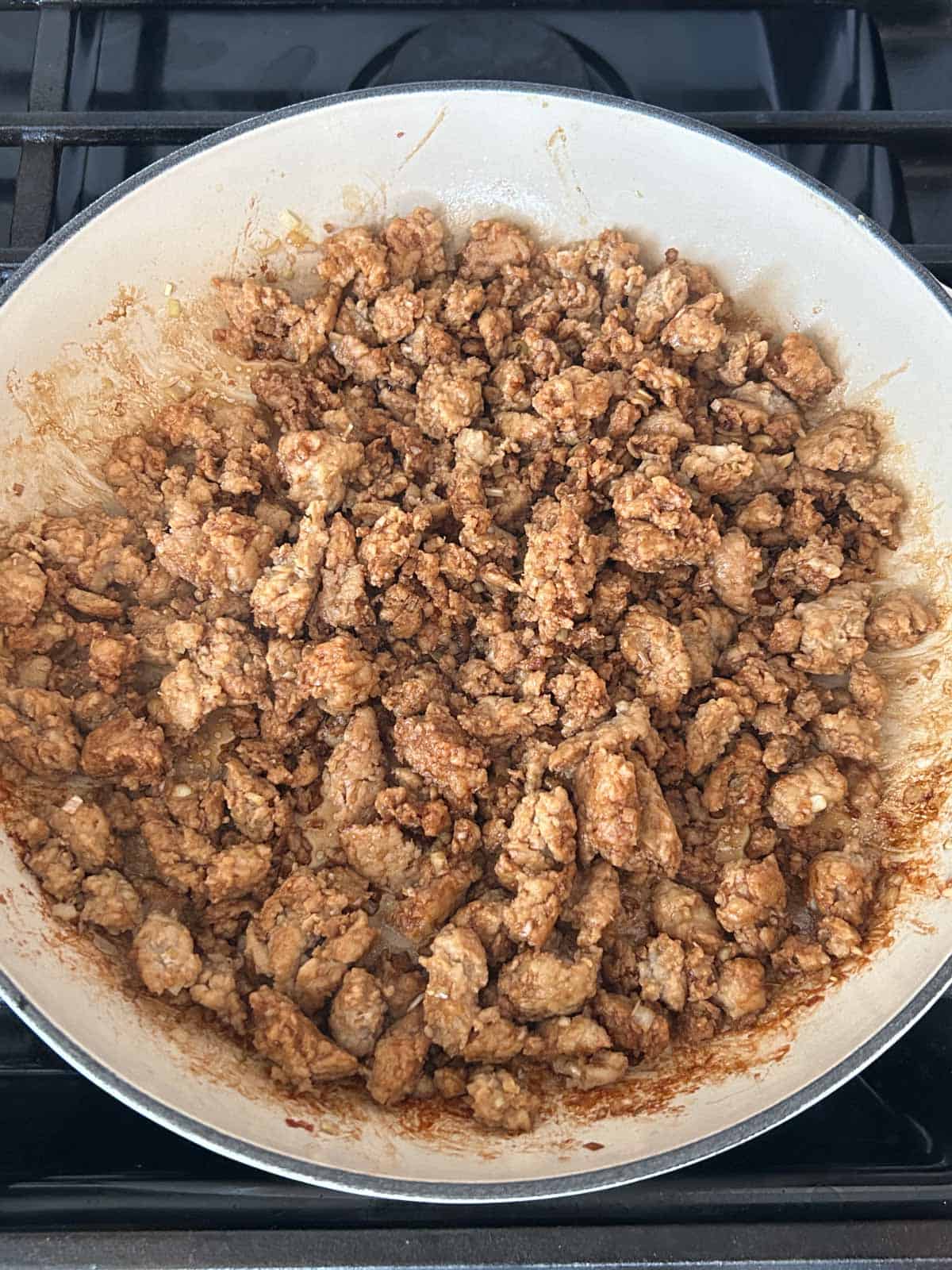 Ground chicken cooked in a pan.