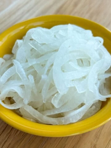Pickled white onions in a bowl.