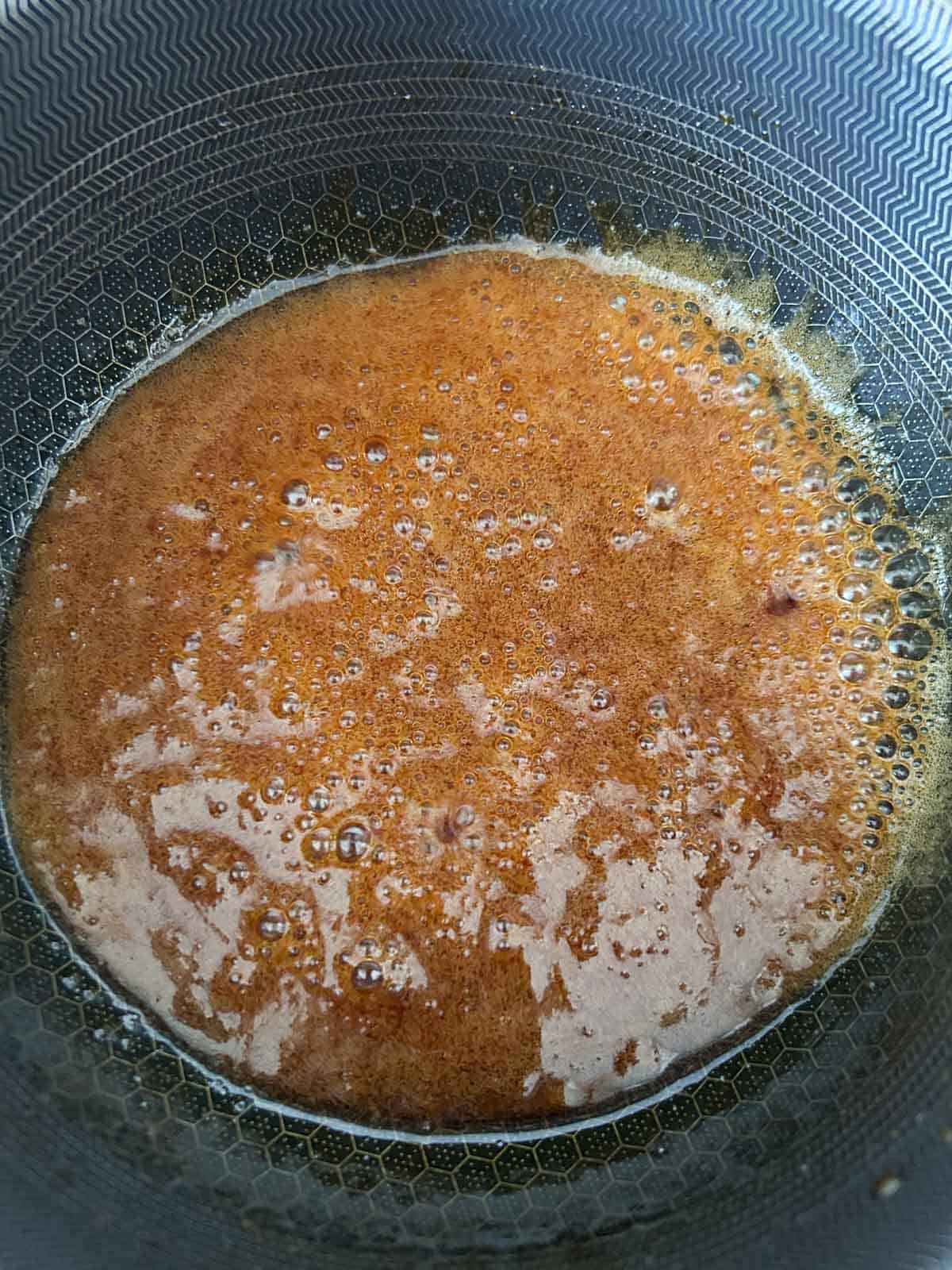 Coconut water bubbling into the caramel to loosen it back into a sauce.